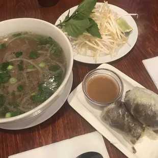 Pho tai (beef noodle soup) and beef spring roll with peanut sauce