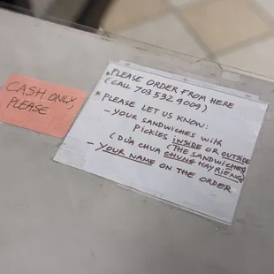a piece of paper taped to a refrigerator door