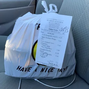 a bag of food in the back seat of a car