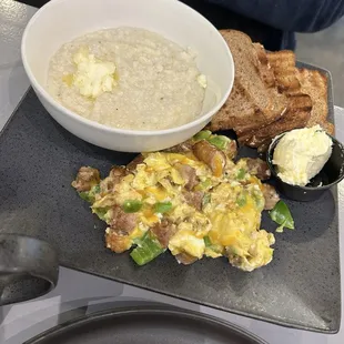 Breakfast of Kitchen Sink Scramble $15 with my favorite buttered grits