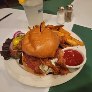 a burger and fries on a plate