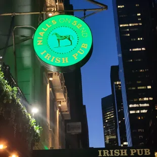 a neon sign for the irish pub