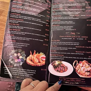 a person holding a menu