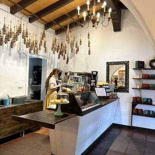 a woman standing behind a counter