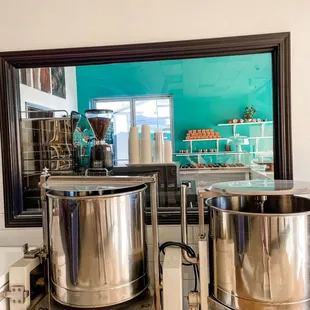 two stainless steel pots on a counter