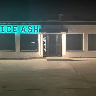 the front of a building at night