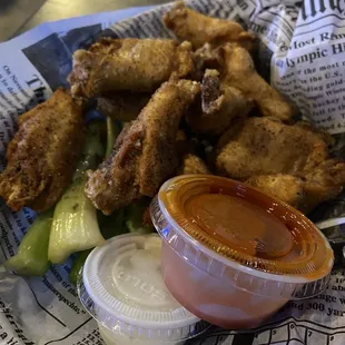 Chicken Wings lemon pepper dry rub with hot sauce on the side