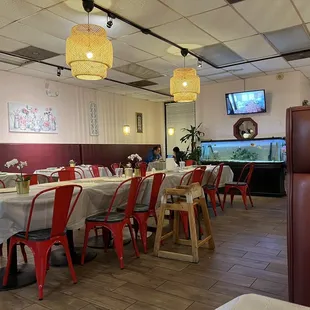 a long table with red chairs