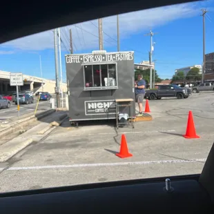 In the H-E-B PARKING LOT near the frontage rd