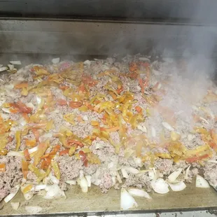 a pile of food being cooked