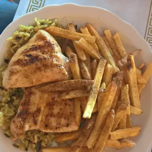 a plate of chicken and french fries