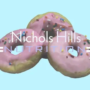 three pink donuts with sprinkles