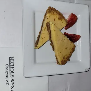 cheesecake and strawberries on a plate