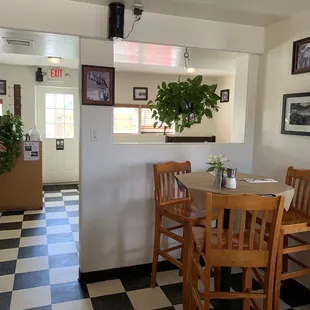 a dining room with a checkered floor