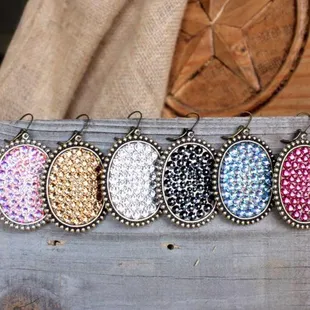 a row of beaded oval pendants