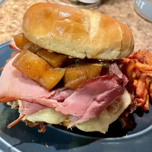 Not sure-it was a special. Pork tenderloin, ham, cheese, cinnamon apples, Chipotle mayo.  Sweet Potato Fries