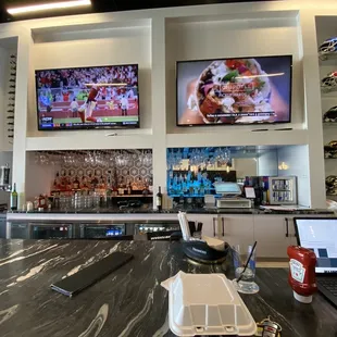 a laptop and televisions