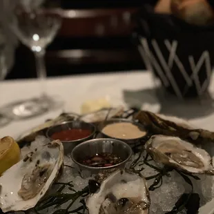 a plate of oysters on ice