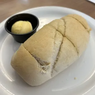 a sandwich on a plate with butter