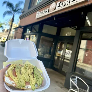Avocado salmon, on a sun-dried tomato bagel