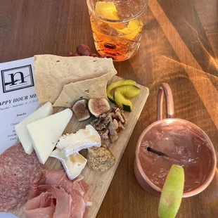 Charcuterie board with a Moscow mule and old fashioned