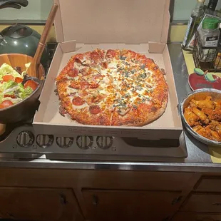 Nick's Pizza, 1/2 Pepperoni and Onion, 1/2 Mushroom and Basil and Nick's Hot Buffalo Chicken Wings.