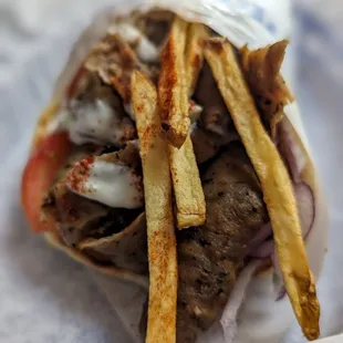 a pita sandwich with french fries
