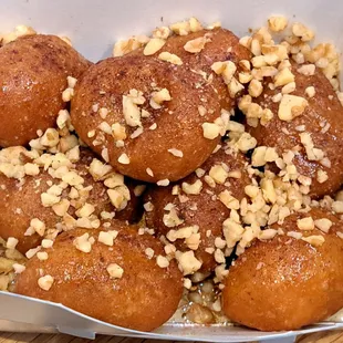 Loukoumades - Greek beignets, nuts and honey syrup $6.95 as of 7/28/22