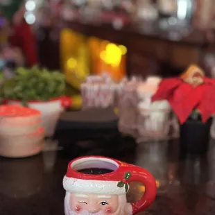 a santa mug on a bar