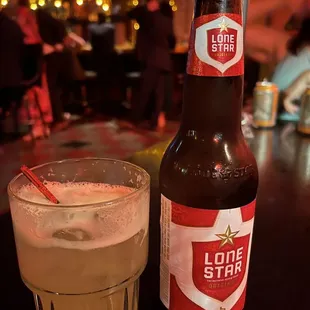 a bottle and a glass of beer