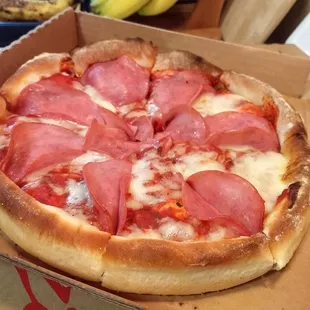 Small Pan Pizza w/ Canadian Bacon. Don&apos;t worry, the actual crust on the bottom is not as thick as the handles.