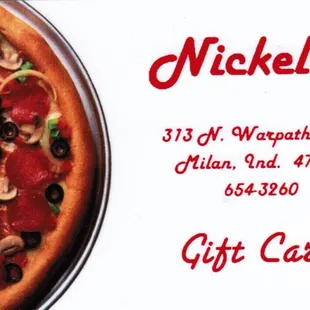 a pizza with olives and mushrooms