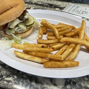 Spicy burger with fries