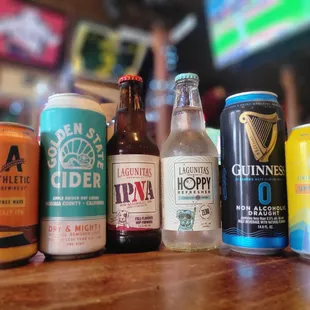 a row of beer cans on a table