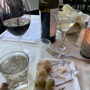 a plate of food and a glass of wine