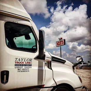 ows a truck parked in a parking lot