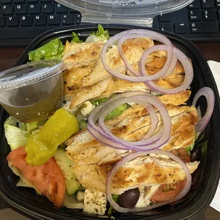 This is the Greek salad with chicken, not pictured (because I already ate it) there absolute super Fresh pita bread!!!!