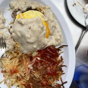 Breakfast biscuit Sandwich with gravy and added hash browns.