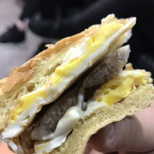 Italian sausage egg and cheese breakfast sandwich on a bulky roll