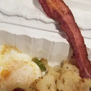 Long black hair holding on to my Bacon.