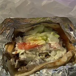 My gyro with a lot of lamb ( on the bottom) and to much lettuce and hardly nothing elae