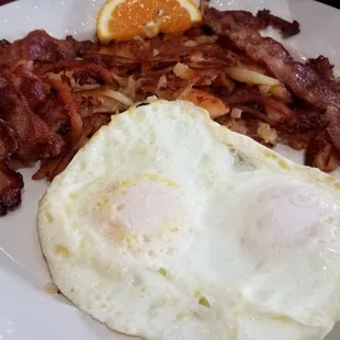 Eggs hash browns bacon and toast very yummy