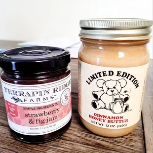 a jar of peanut butter and a jar of strawberry jam