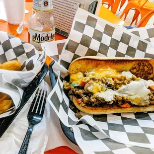 I had the Triple cheese philly and twisted fries with a Modelo to drink.