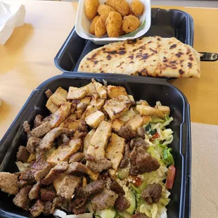 two trays of food on a table