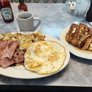 two plates of breakfast food