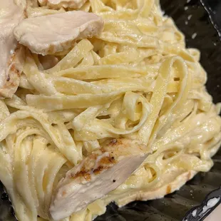 Spongy texture chicken Fettuccine Alfredo that was dry.