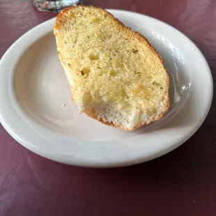 Garlic bread next to a Dr Pepper