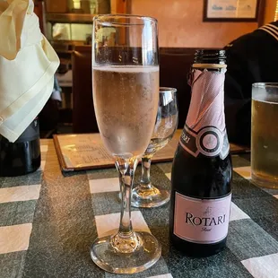 a glass of wine and a bottle of wine