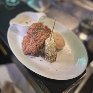 Buttermilk Fried Chicken Specialty: served boneless w/mashed potatoes, buttermilk biscuit, sausage country gravy (SOS) &amp; roasted corn | $26